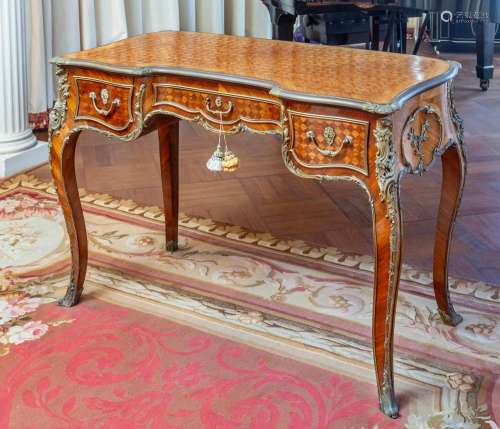 A fine parquetry and gilt-bronze mounted writing table,Label...