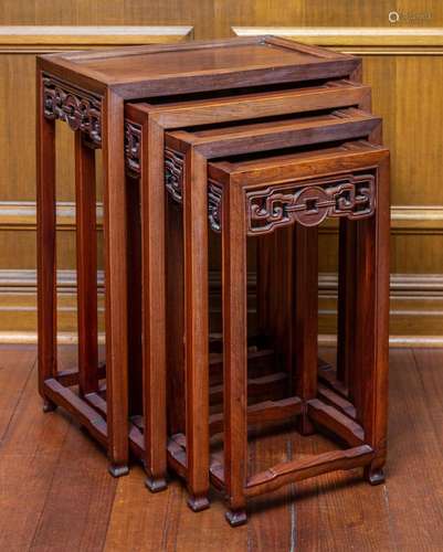 A nest of four Chinese hardwood occasional tables, early 20t...