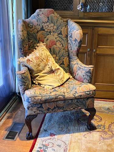 A George III style mahogany and tapestry wing armchair, Engl...