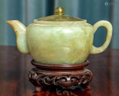 A Chinese green celadon bonite teapot 8cm high,15cm wide acr...