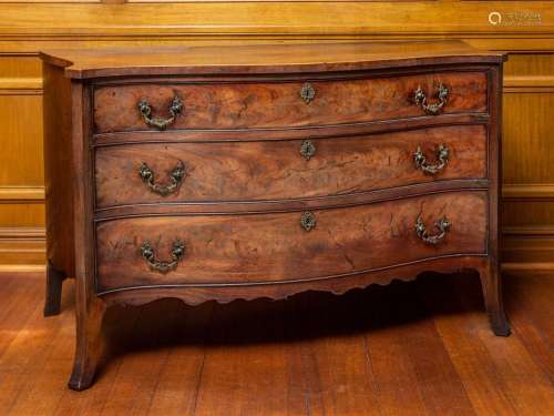 A fine and rare George III mahogany serpentine-fronted chest...