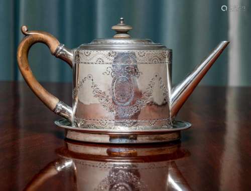 A George III sterling-silver oval teapot and a matched teapo...