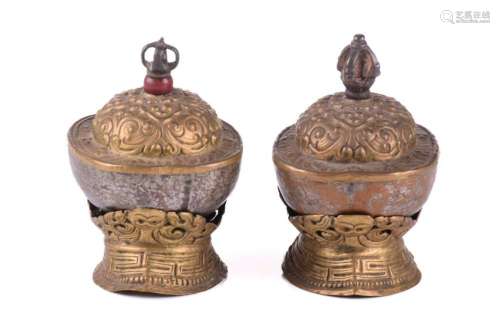 A close pair of Tibetan kapala and stands, early 20th centur...