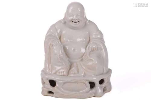 A Chinese blanc de chine figure of Buddha, seated in flowing...