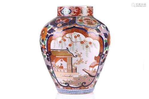 A large Japanese Imari pattern vase, with two reserves decor...