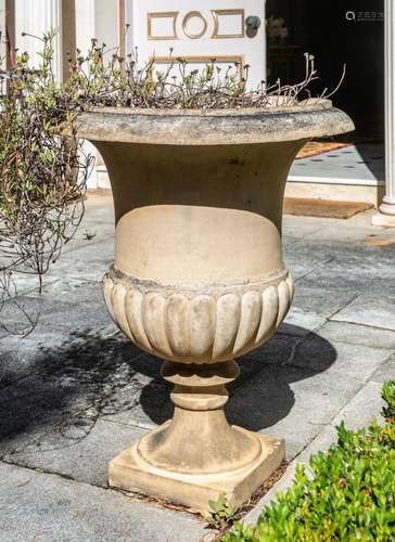 A pair of Coade type stone urns, of Classical Grecian style ...