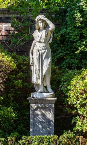 A Carrara marble figure of a Classical Italian lady in a loo...