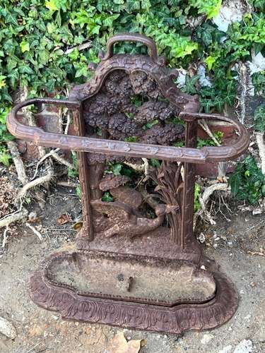 A Victorian cast-iron umbrella stand, English circa 1900 and...