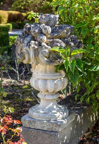 A carved sandstone fruit and urn finial, French 19th century...