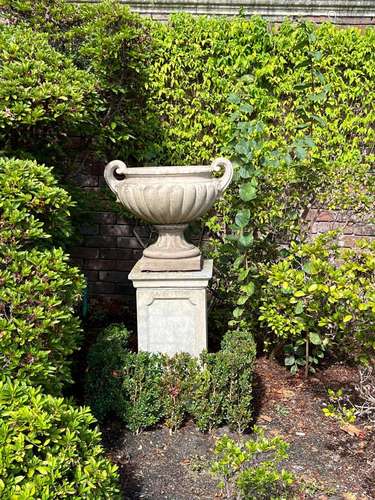 A pair of Coade type stone twin handles urns of Classical Gr...