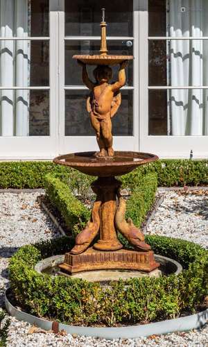 A cast-iron two-tier cherub and dolphin fountain,19th centur...