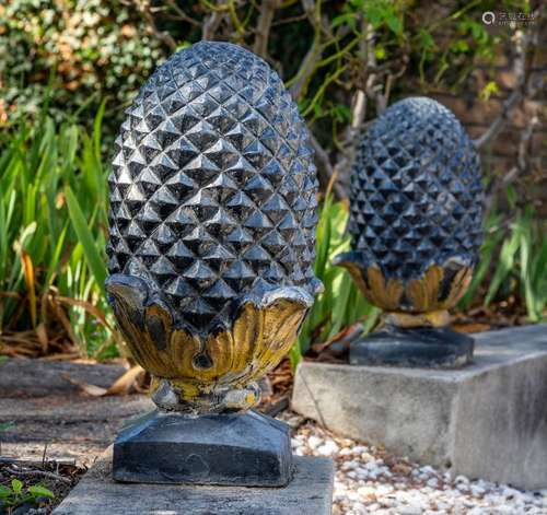 A pair of cast pineapple finials 44cm high