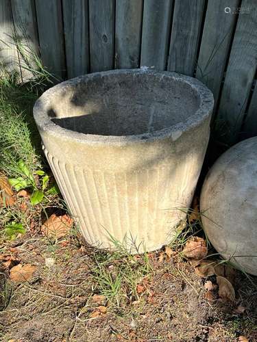 A reconstituted stone urn 38cm high 44cm diameter