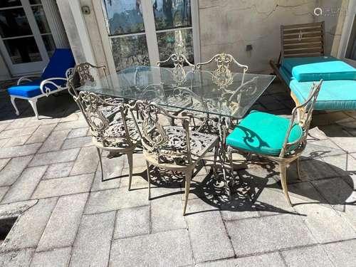 An Italian ornate cast metal glass top patio table and eight...