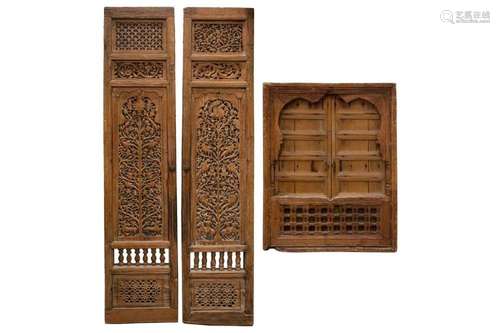 A matched pair of 19th-century teak Haveli screen doors with...