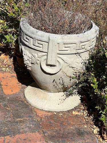 A concrete circular planter and various terracotta and other...