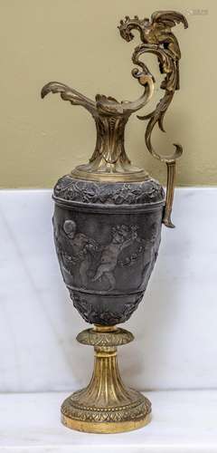 A bronze and gilt bronze ewer after the ancient Greek origin...