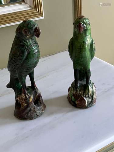 A pair of Chinese green- glazed parrots approx 24cm high