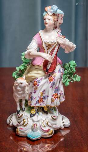 A Bow porcelain figure of a lady with a sheep, English circa...