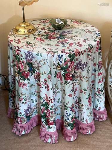 A decorator table with chintz cover 61cm high,60cm wide