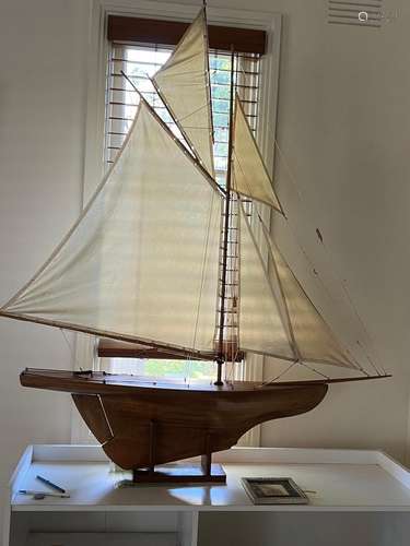 A large vintage polished wood pond yacht 156cm high approx. ...