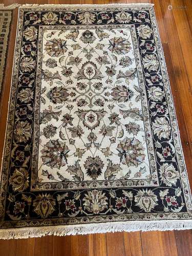 A small Persian style wool-pile rug 130cm by 38cm