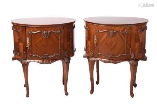 A pair of Louis XV-style oval mahogany double-sided night ta...