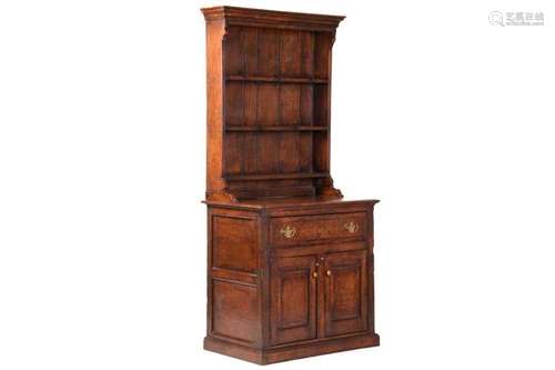 A craftsman-made George III-style oak dresser and rack of sm...