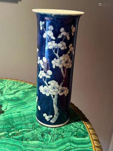 A Chinese blue and white prunus decorated cylindrical sleeve...