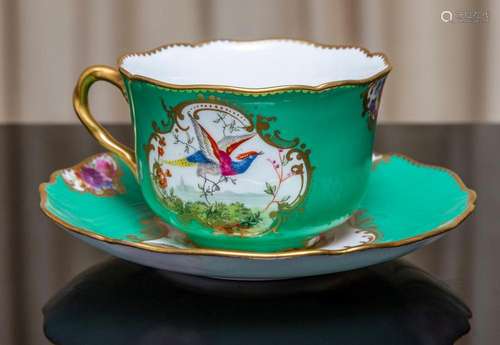 A Royal Doulton Chinoiserie green ground cabinet cup and sau...