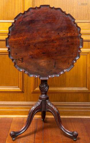 A very fine and elegant George II carved mahogany pie crust ...