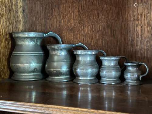 A run of five pewter tankard measures English 18th/19th cent...