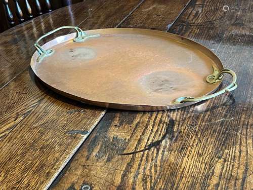 An oval Arts-and-Crafts copper tray with brass Art-nouveau s...