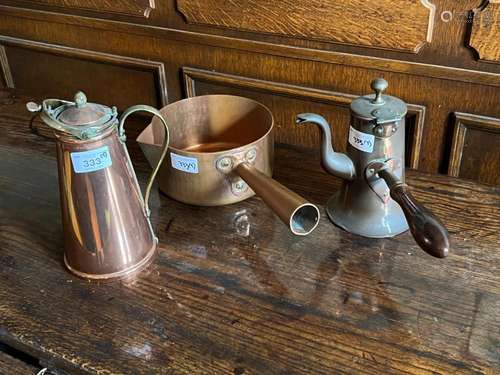 A copper saucepan, a copper coffee-pot and copper warming ju...