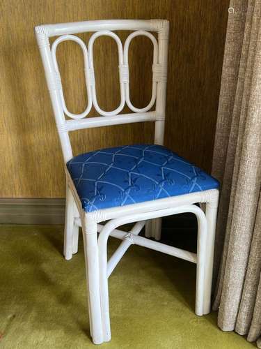 A set of four white painted cane dining chairs 89cm high, se...