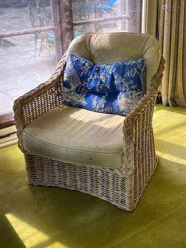 A pair of cane armchairs with cushion seats and backs and ma...