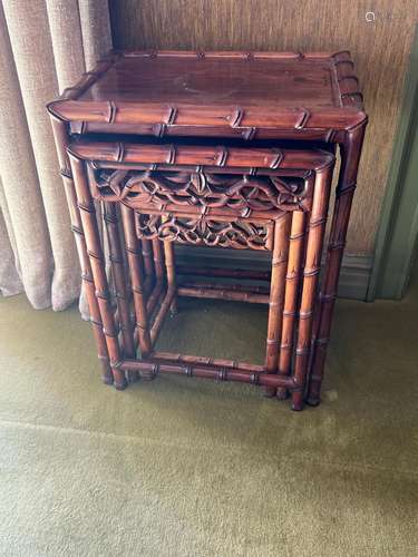 A nest of three Chinese hardwood bamboo pattern tables large...