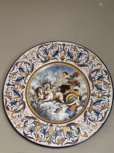 A large maiolica circular dish painted with Zeus and horse d...