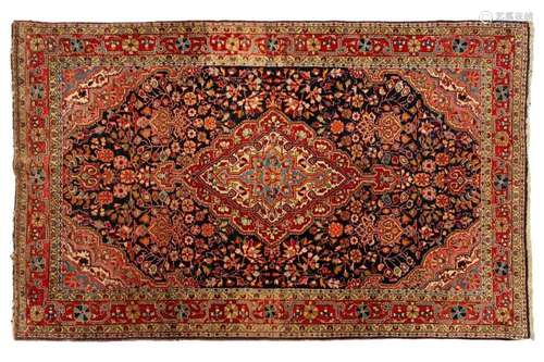 A dark blue ground Baktiari rug, 20th century, with a centra...