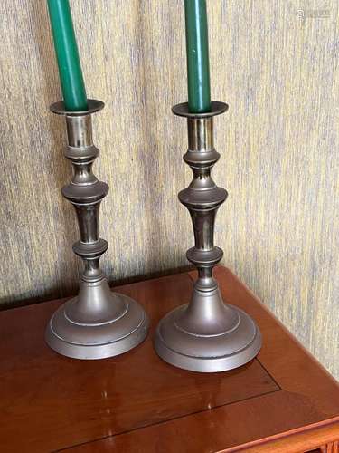 A pair of Victorian brass candlesticks 25cm high