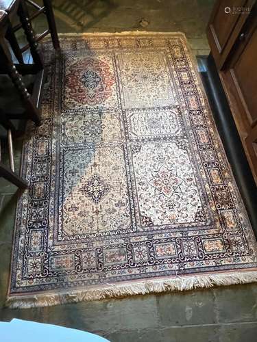 A modern Qum part-silk rug 180cm by 124cm