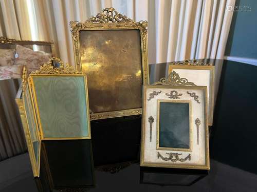 Four various good quality gilt-metal photograph frames, circ...