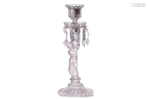 A Baccarat crystal glass candlestick, with frosted glass fig...