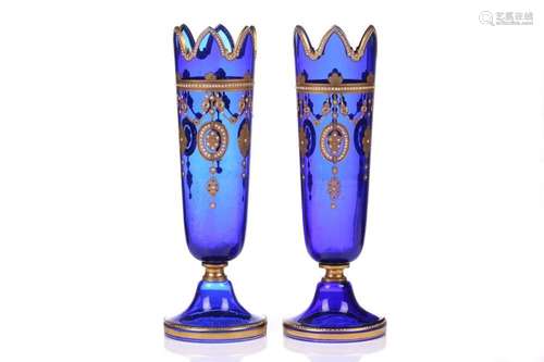 A pair of blue glass and gilt-decorated vases, of turreted f...