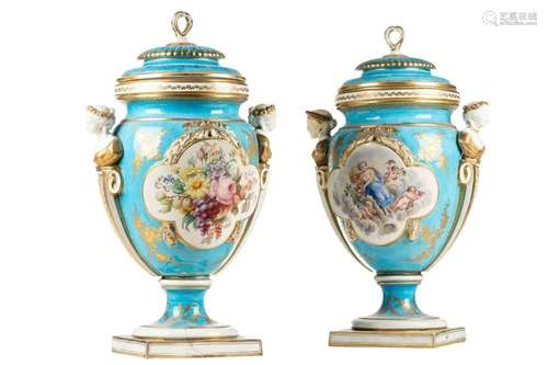 A pair of large Sevres porcelain bleu celeste urns and cover...