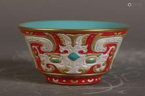 Carved and painted gold cup on red ground