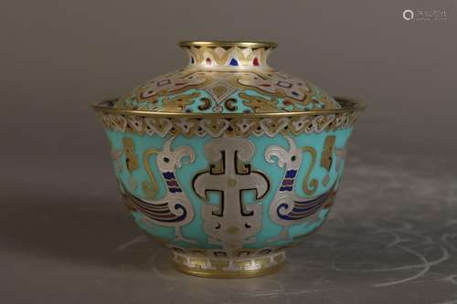 Covered bowl with gold and engraved pattern on blue ground