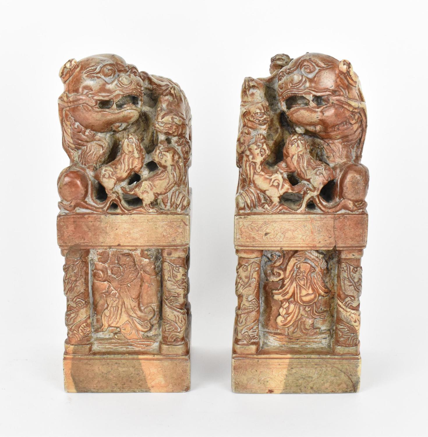 A pair of carved soapstone models of temple guardian Foo dog