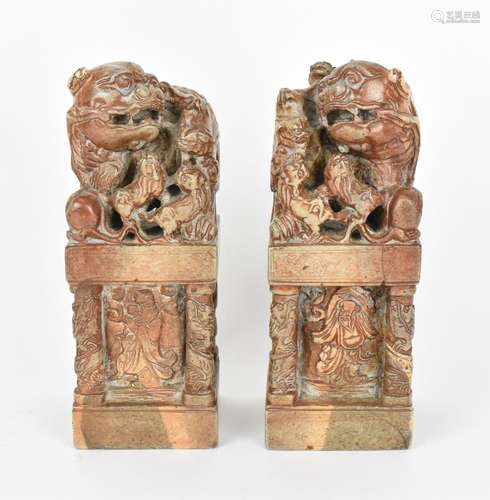 A pair of carved soapstone models of temple guardian Foo dog...