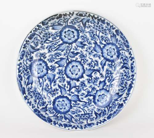 A Chinese Qing dynasty blue and white porcelain charger, pos...